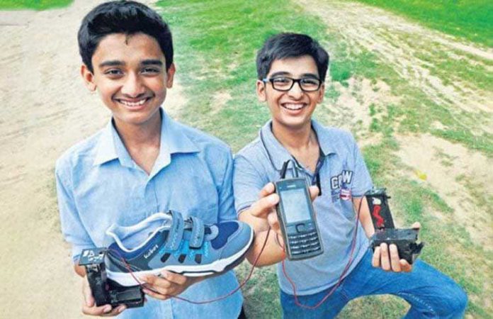 Anand Gangadharan left and Mohak Bhalla with their portable shoe mobile phone charger