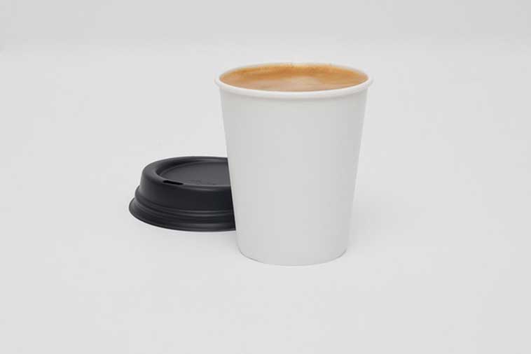 Tree-free calcium paper disposable cup filled with coffee