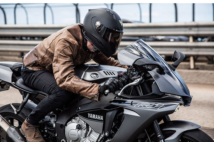 A man riding with Forcite smart motorcycle helmet