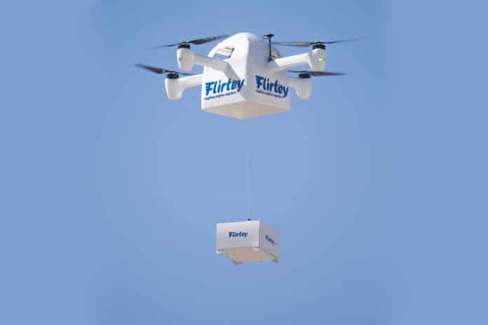 Flirtey Eagle delivery drone uses a tether to lower the package at the drop-off location.