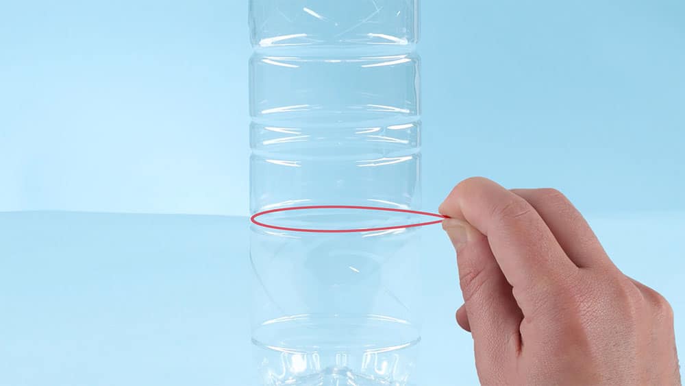 A biodegradable rubber band strapped around a particular part of the bottle.