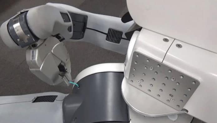 Researchers from the University of Tokyo taught this PR2 robot how to tighten screws on its own body.