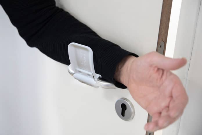 The hands-free door opener allows you to open doors without having to touch the handle.