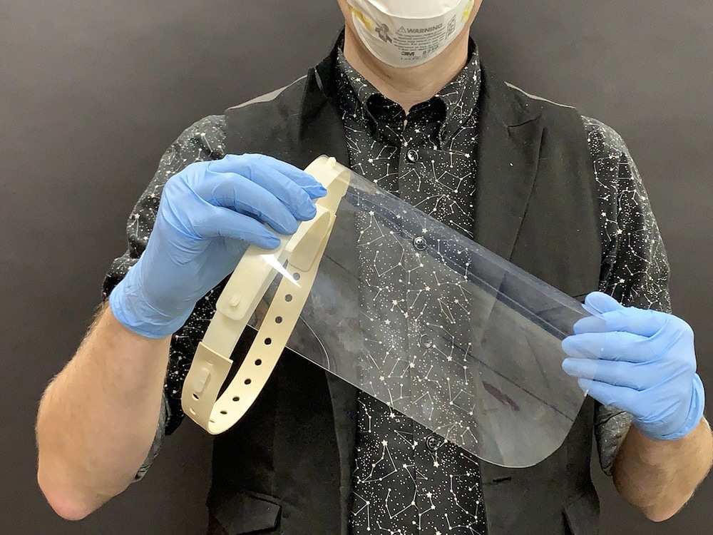 The team modified an open-source design for a plastic face shield with a polypropylene frame and a rubber strap.