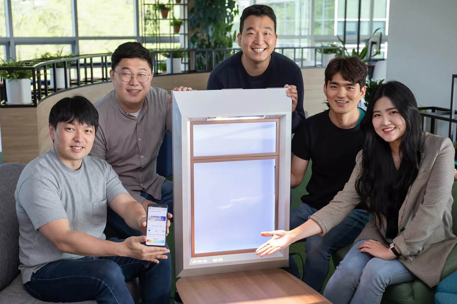 The SunnyFive team with their window that can generate artificial sunlight.