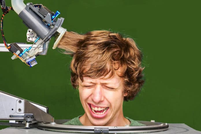 This inventor built a robotic barber and bravely tried it on himself.