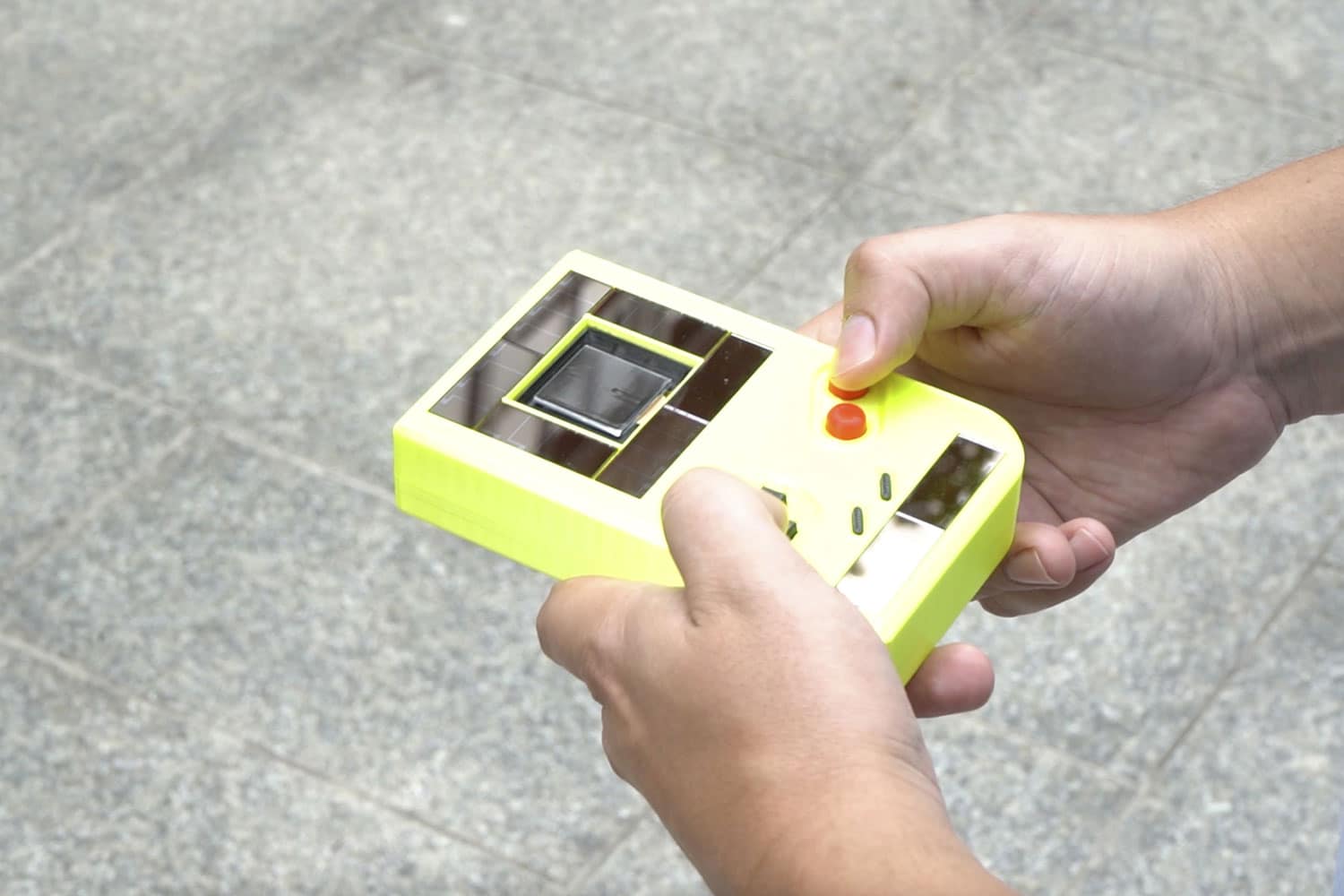 Battery-free Game Boy harvests energy from the sun and the user.