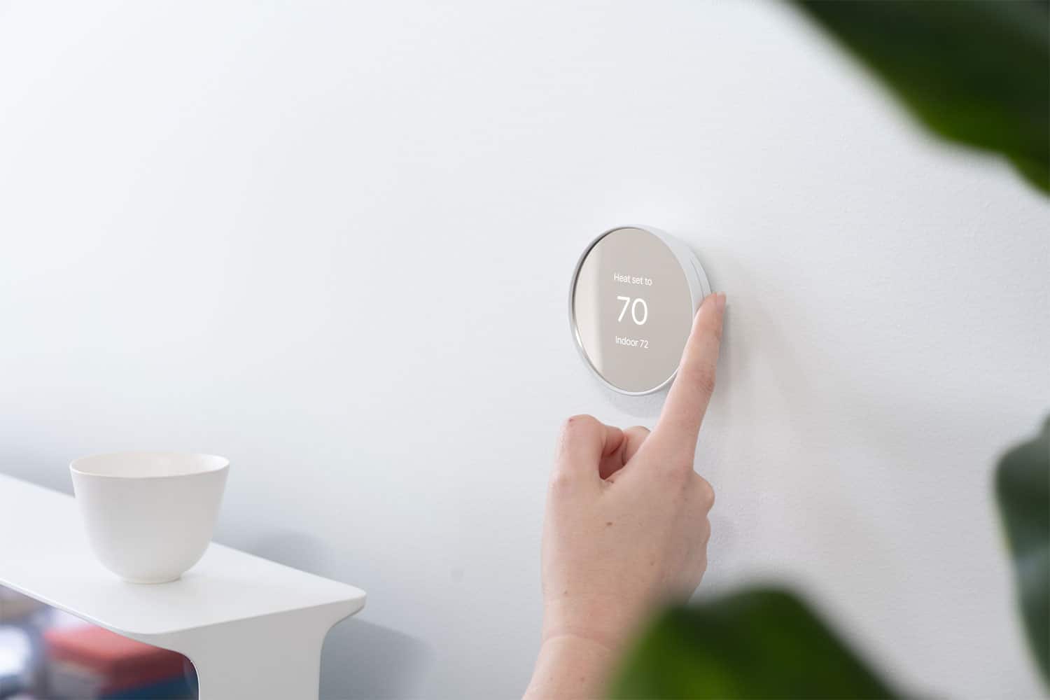 Google launches Nest Thermostat with simpler design and touch control.