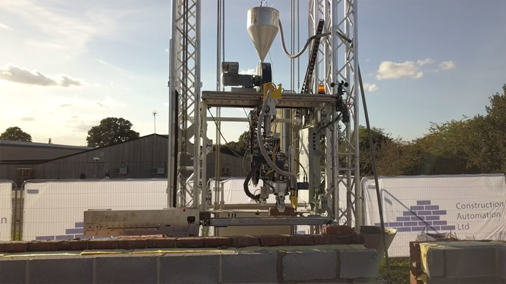 The machine is mounted on a track a rides atop a 30 foot (9 metres) high frame