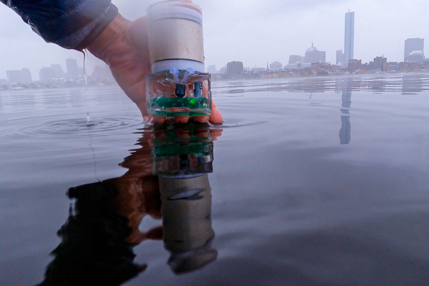 This photo shows the battery-free sensor encapsulated in a polymer before it is dipped into the Charles river.