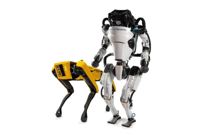 Boston Dynamics' robotic dog Spot and the humanoid robot Atlas.