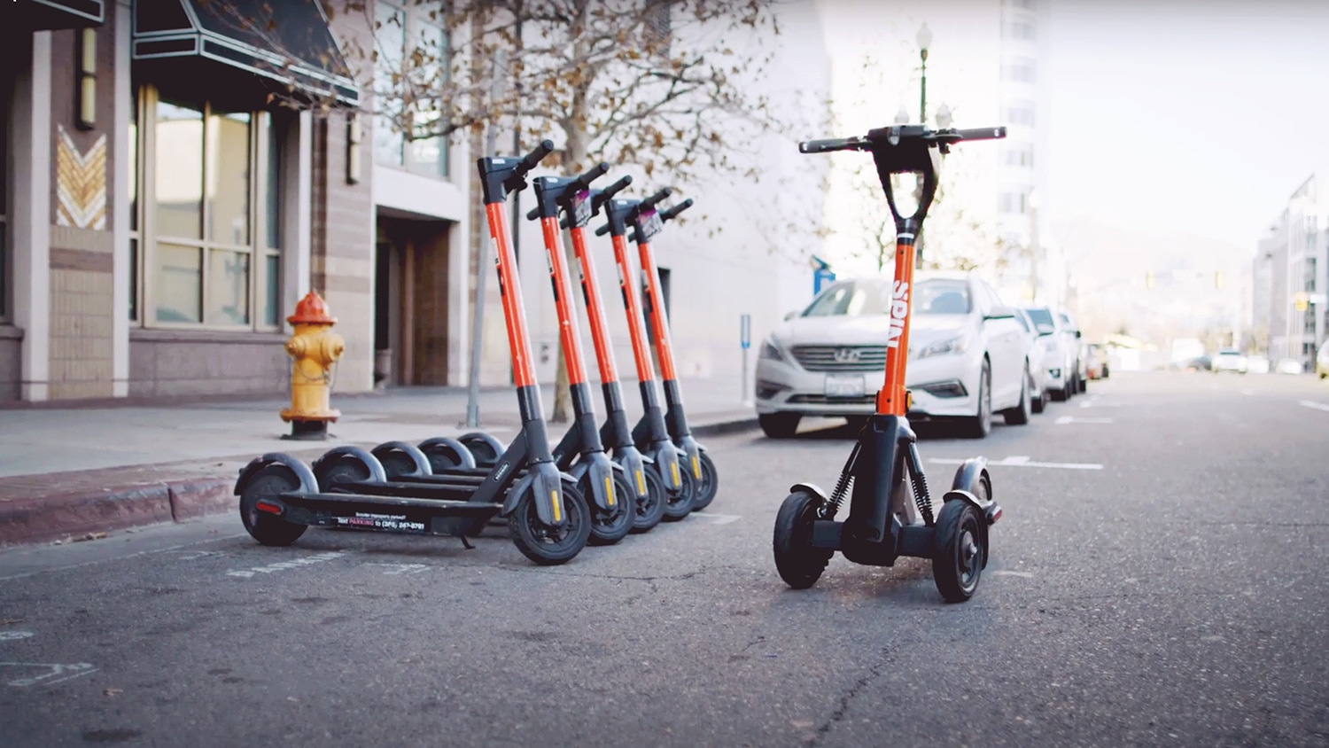 Spin's 3-wheeled e-scooters can be operated remotely to prevent sidewalk clutter.