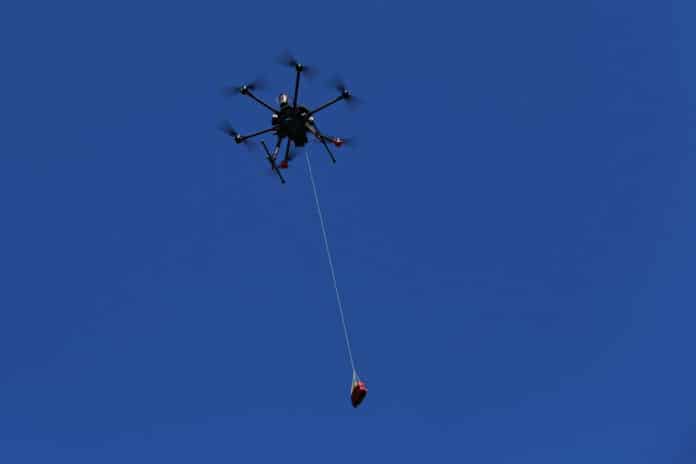 Drone delivers defibrillator in response to a suspected cardiac arrest.