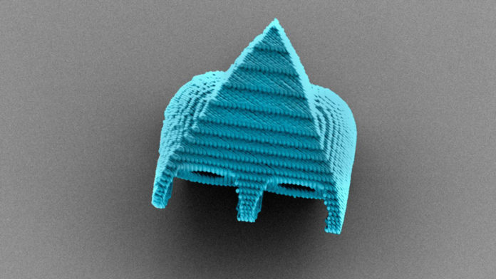 A scanning electron microscope image shows a cell-size robotic swimmer that can be powered and steered by ultrasound waves.