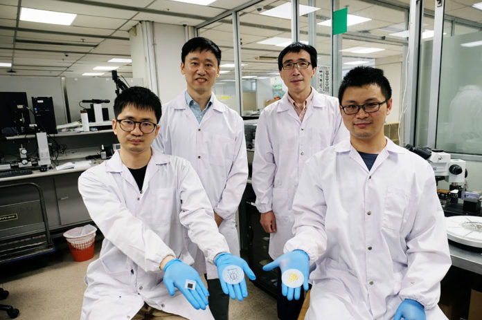 The research team eith their paper-thin bidegradable batteries.