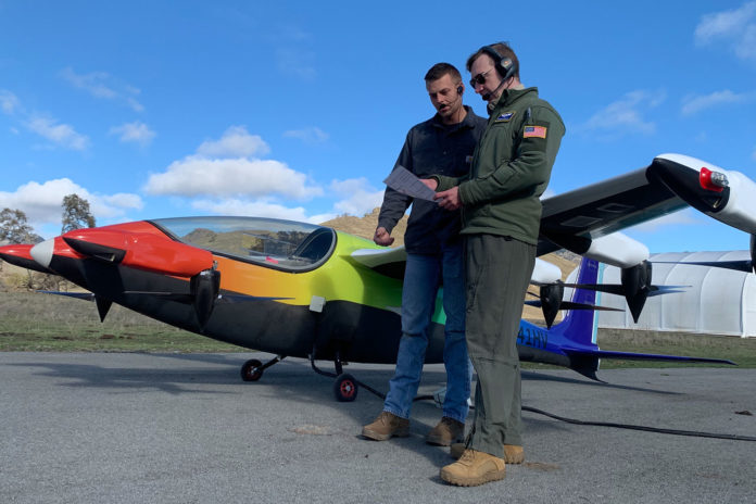 Parker Downey, left, of Kittyhawk, and Terrence McKenna, an Air Force Reserve pilot with the 370th Flight Test Squadron and the Test and Experimentation Lead for AFWERX Agility Prime, (right) conduct preflight checks in anticipation of the first Heaviside flight by an Air Force pilot.