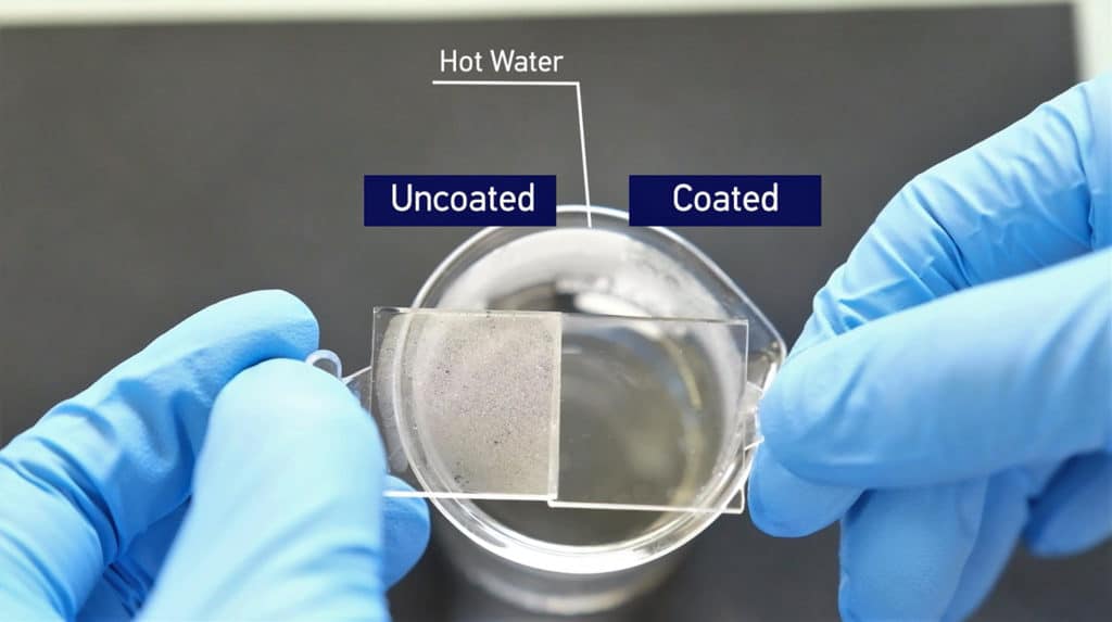 The uncoated plastic substrate fogged when exposed to steam from hot water (left), while no water vapour condensation is seen on the coated sample (right).
