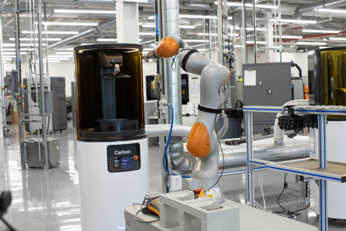 Ford uses mobile robots to operate 3D printers without human help.