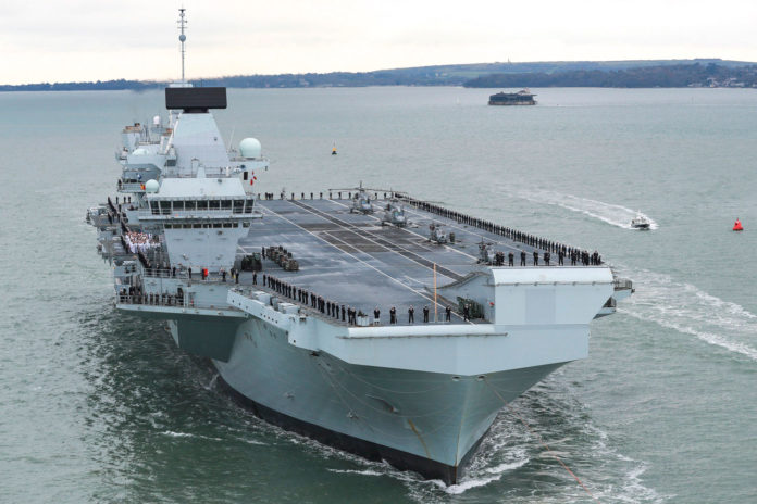 Royal Navy installs world's first atomic clock on its biggest warship.