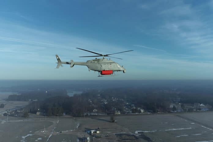 The MQ-8 Fire Scout, with mass shapes attached, conducts low airspeed flying qualities testing in February 2022 at Webster Field, Md. to prepare for upcoming the Single System Multi-Mission Airborne Mine Detection (SMAMD) demonstration.