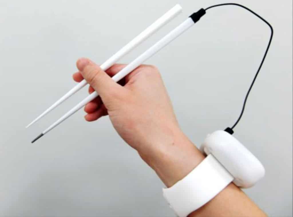 The chopstick uses electrical stimulation and a mini-computer worn on a wristband.
