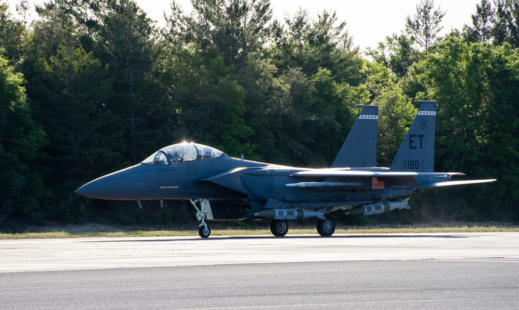 An F-15E Strike Eagle equipped with modified 2,000-pound GBU-31 Joint Direct Attack Munitions prepares for takeoff.
