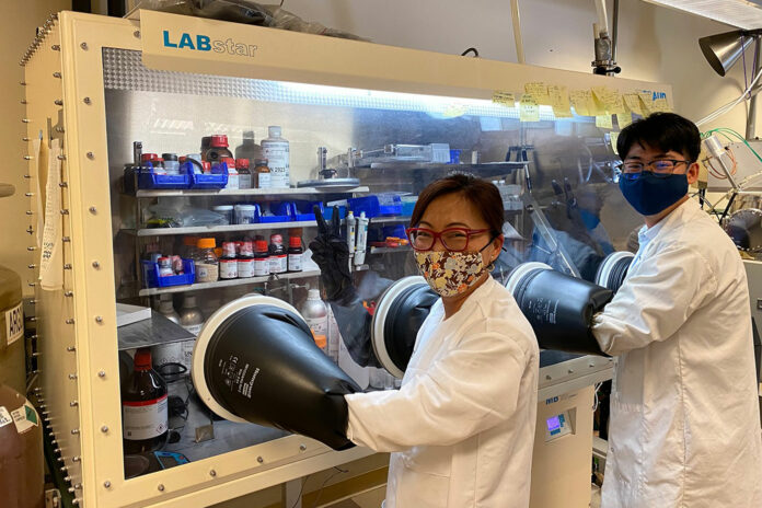 Yijie Yin and Professor Shirley Meng working in the lab to develop this lithium-battery electrolyte.