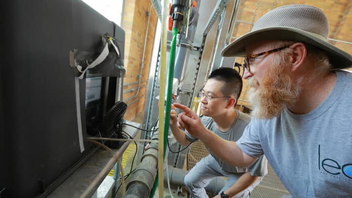 Dr. Thomas Bridgeman, right, and Dr. Kuo-Pei Tsai, a post-doctoral research associate, read data coming from the online algae monitoring system.