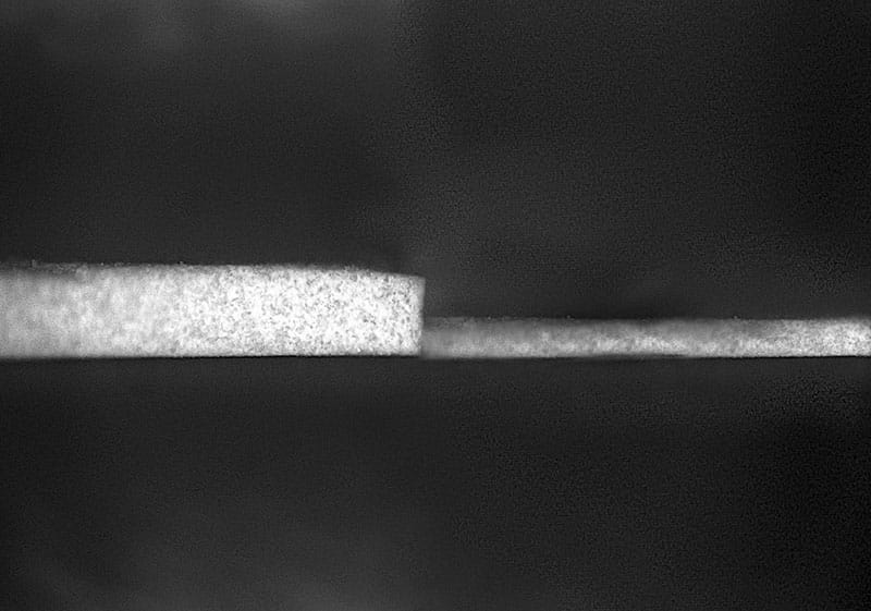 The previous iteration (left) required a layer 0.4 millimeters thick to achieve sub-ambient radiant cooling. The new formulation can achieve similar cooling with a layer just 0.15 millimeters thick.