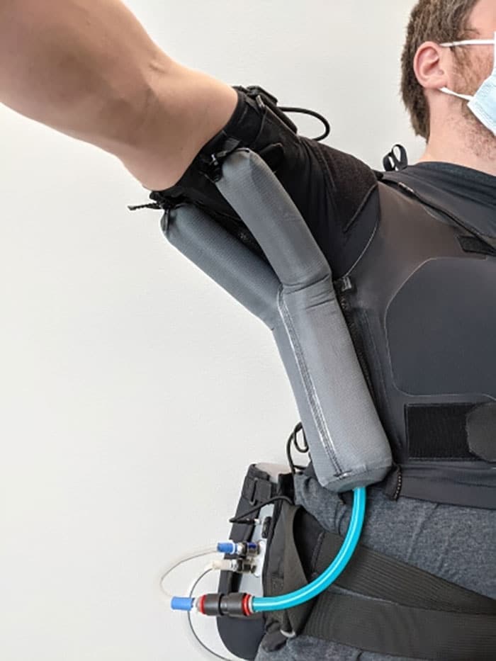 Balloon actuators attached to the wearable move the person’s arm smoothly and naturally.