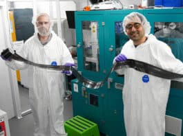 Dr David Beynon (Left) and Dr Ershad Parvazian (Right) hold a sample of the new fully roll-to-roll (R2R) coated device.