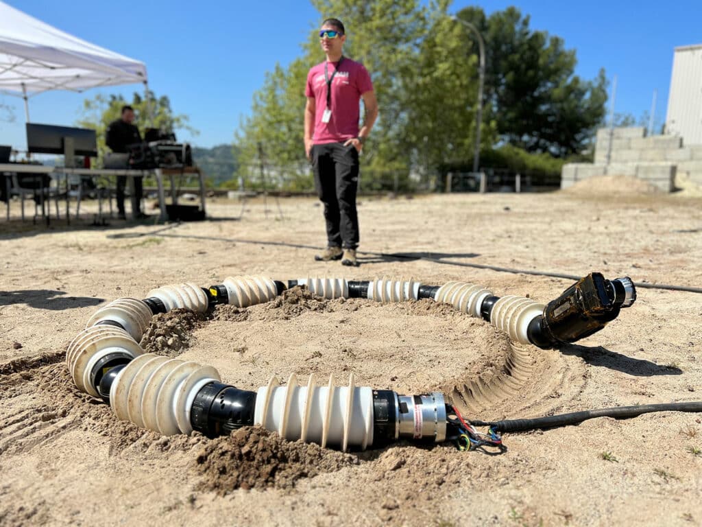 EELS is tested in the sandy terrain of JPL’s Mars Yard in April. Engineers repeatedly test the snake robot across a variety of terrain, including sand, snow, and ice.