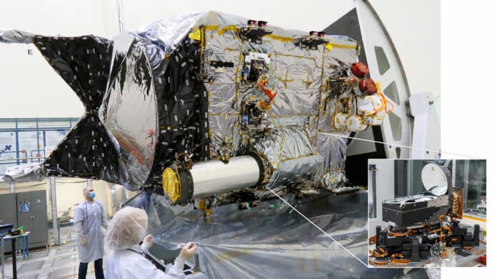 The Deep Space Optical Communications (DSOC) flight transceiver is inside a large tube-like sunshade and telescope on the Psyche spacecraft, as seen here inside a clean room at JPL. An earlier photo, inset, shows the transceiver assembly before it was integrated with the spacecraft.