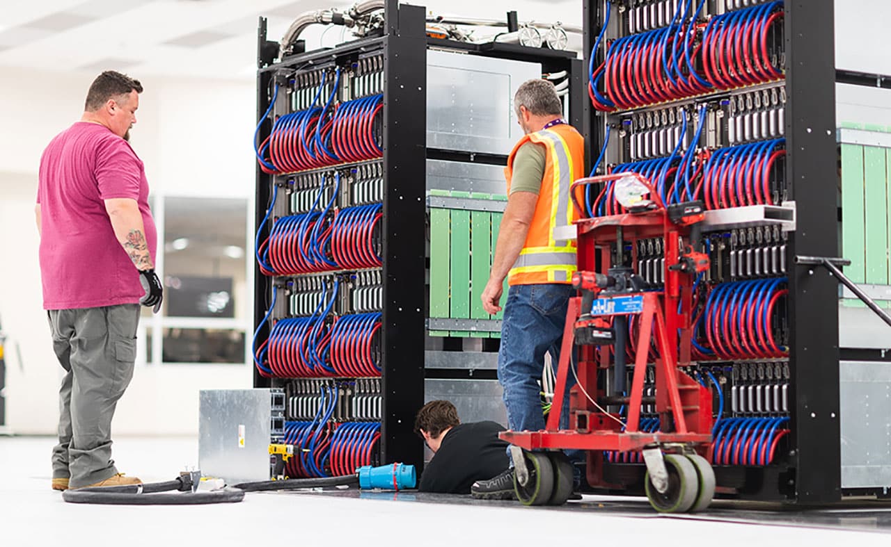 Crews install Crossroads components at the Lab's Strategic Computing Complex.