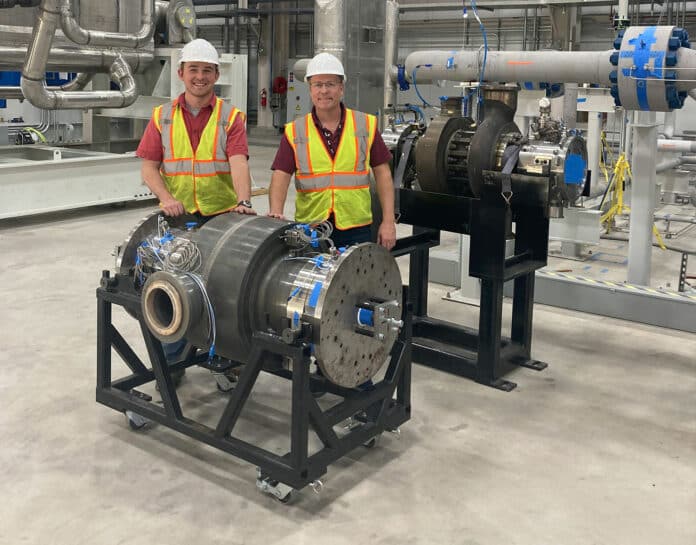 SwRI’s John Klaerner, lead turbine engineer, and Dr. Jeff Moore, the principal investigator of the STEP Demo project, are pictured with the sCO2 turbine developed by SwRI for the 10 MWe demonstration plant.