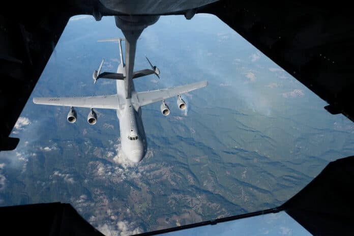 A C-5M Super Galaxy approaches the boom of a KC-10 Extender to perform reverse aerial refueling training.