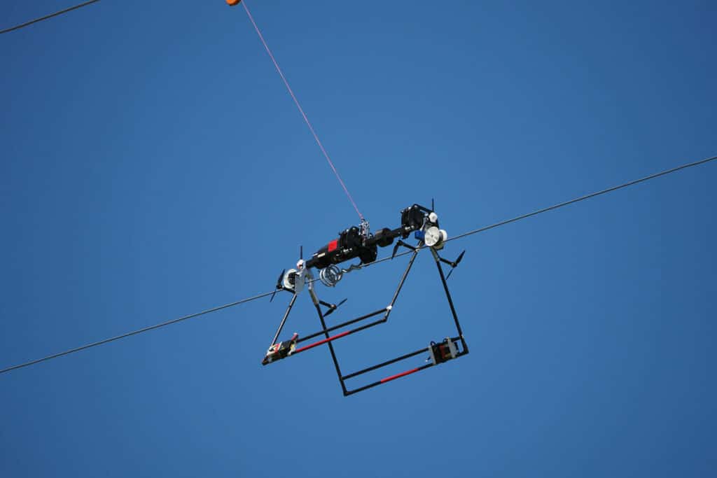 The Mini LineFly automatically and precisely installs diverters on overhead conductors.