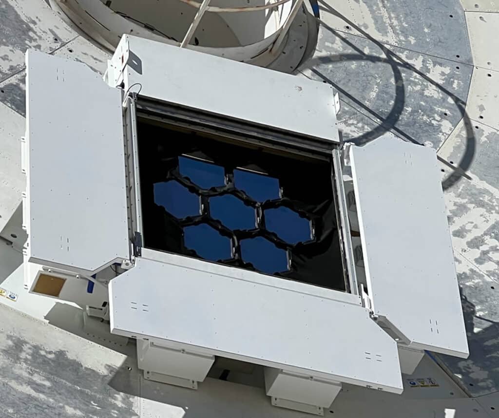 A close-up of the optical terminal on Deep Space Station 13 shows seven hexagonal mirrors that collect signals from DSOC’s downlink laser.