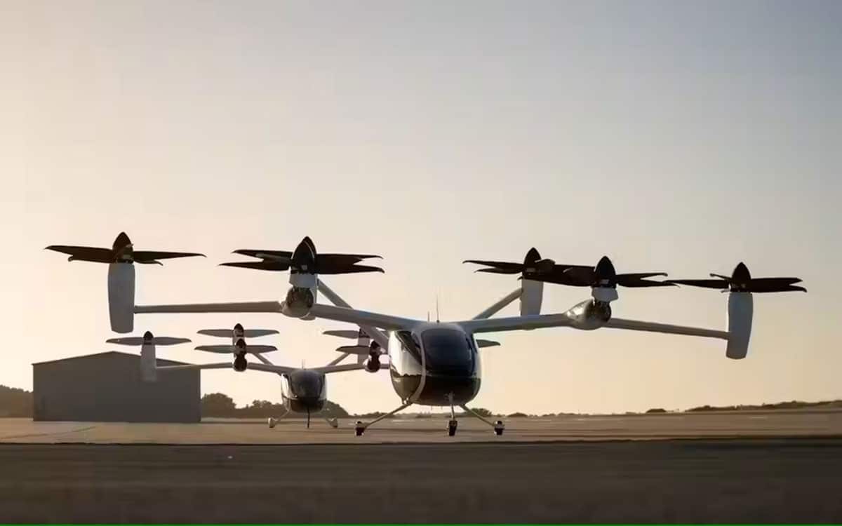 Two of Joby’s prototype electric air taxi aircraft at the company’s flight test and manufacturing facilities in Marina, California.