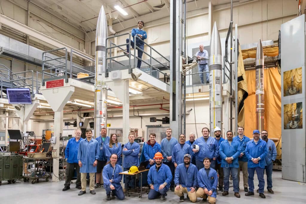 This photo shows the three APEP sounding rockets and the support team after successful assembly. The team lead, Aroh Barjatya, is at the top center, standing next to the guardrails on the second floor.