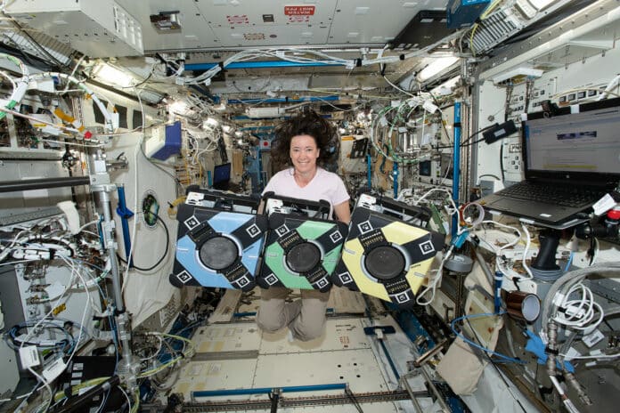 NASA astronaut Megan McArthur with the Astrobee robotic free-flyers